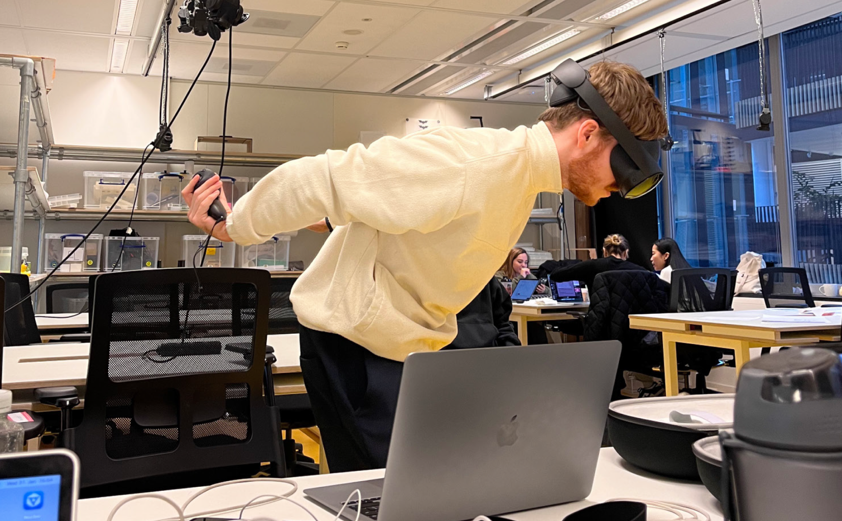 VR playtesting — user wearing Meta Quest Pro testing the flying mechanic with extended arms and controllers