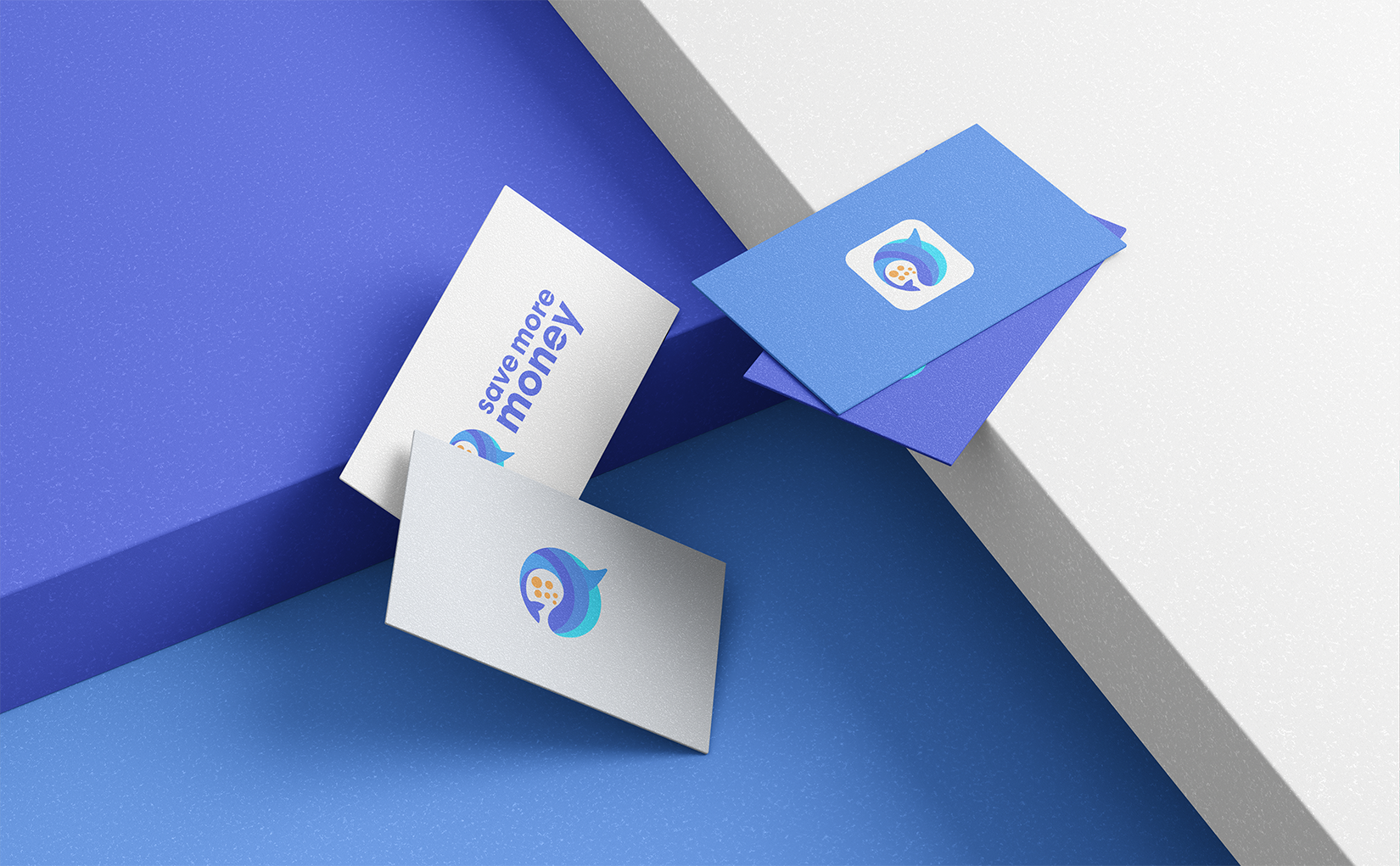 Savemoremoney business card mockups — white and Royal Blue variants showing the whale-speech-bubble logo and wordmark